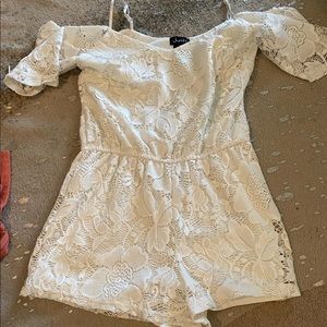 A white off the shoulder romper